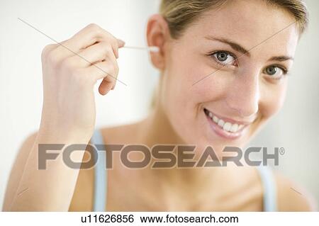 Cleaning ears View Large Photo Image Stock Photograph - Cleaning ears. Fotosearch