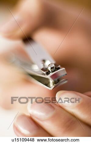Clipping nails View Large Photo Image Stock Photo - Clipping nails. Fotosearch