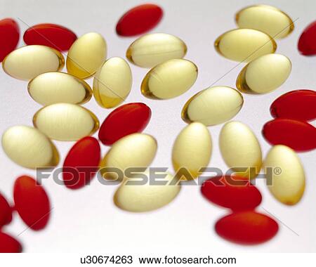 Cod liver oil and Nurofen capsules View Large Photo Image Stock Image - Cod liver oil and Nurofen capsules. Fotosearch