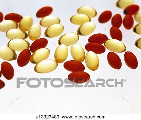 Stock Photo - Cod liver oil and Nurofen capsules. Fotosearch