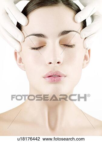 Stock Image - Cosmetic surgery, conceptual image. Fotosearch