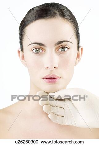 Stock Image - Cosmetic surgery, conceptual image. Fotosearch