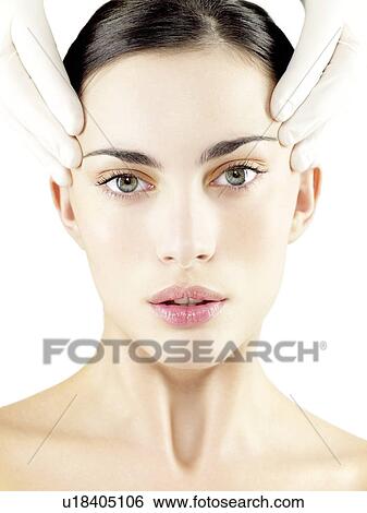 Stock Photograph - Cosmetic surgery, conceptual image. Fotosearch