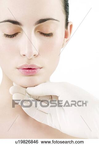 Stock Photograph - Cosmetic surgery, conceptual image. Fotosearch