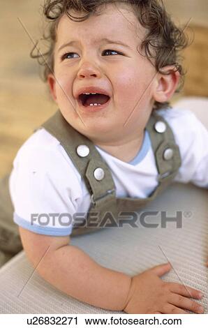 Stock Image - Crying baby boy. Fotosearch