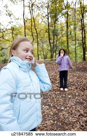 Stock Photography - Cup-and-string telephone. Fotosearch