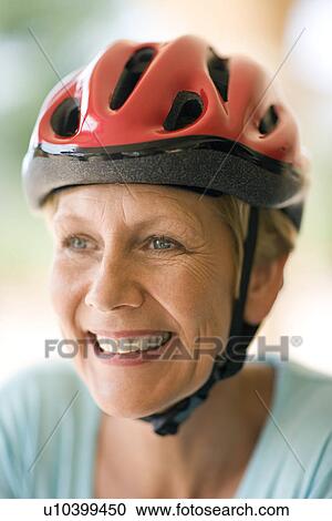 Stock Image - Cyclist wearing a helmet. Fotosearch
