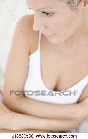 Stock Image - Depressed young woman. Fotosearch