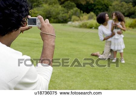 Stock Photography - Digital camera use. Fotosearch