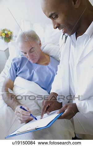 Picture - Doctor and patient. Fotosearch