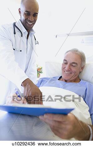 Stock Photograph - Doctor and patient. Fotosearch