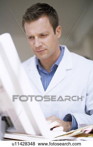 Doctor typing notes View Large Photo Image Stock Photo - Doctor typing notes. Fotosearch