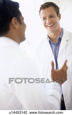 Doctors talking View Large Photo Image Stock Image - Doctors talking. Fotosearch