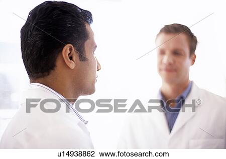 Doctors talking View Large Photo Image Stock Image - Doctors talking. Fotosearch