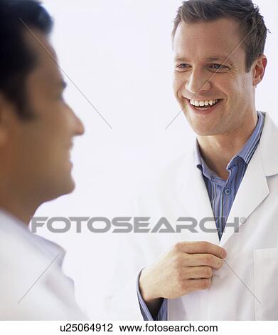Stock Image - Doctors talking. Fotosearch