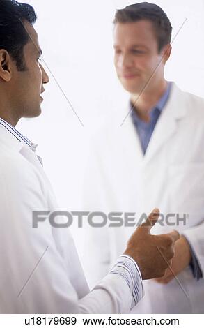 Stock Photo - Doctors talking. Fotosearch