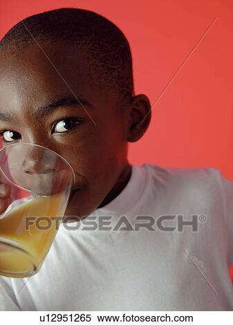 Stock Photography - Drinking orange juice. Fotosearch