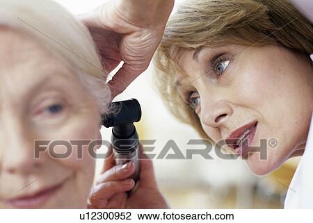 Ear examination View Large Photo Image Stock Image - Ear examination. Fotosearch