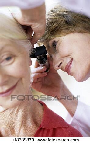 Stock Image - Ear examination. Fotosearch
