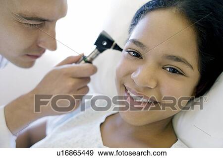 Ear examination View Large Photo Image Stock Photo - Ear examination. Fotosearch