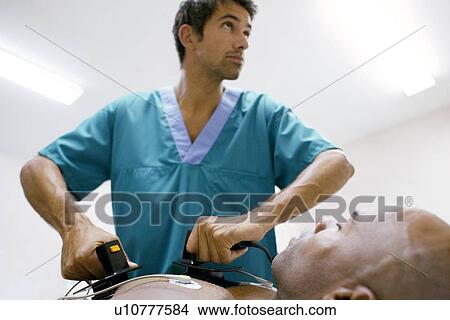 Picture - Emergency defibrillation. Fotosearch