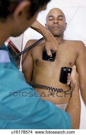 Emergency defibrillation View Large Photo Image Picture - Emergency defibrillation. Fotosearch