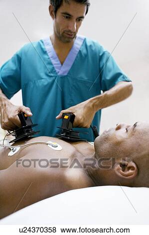 Stock Photo - Emergency defibrillation. Fotosearch