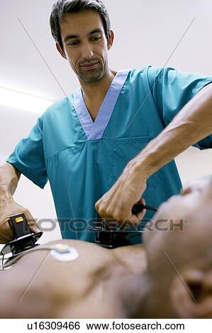Emergency defibrillation View Large Photo Image Stock Photograph - Emergency defibrillation. Fotosearch