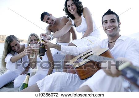 Friends relaxing View Large Photo Image Stock Image - Friends relaxing. Fotosearch