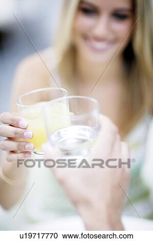 Friends toasting their drinks View Large Photo Image Stock Image - Friends toasting their drinks. Fotosearch