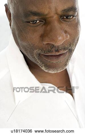 Stock Photograph - Frowning man. Fotosearch