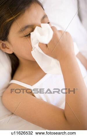 Girl blowing her nose View Large Photo Image Stock Image - Girl blowing her nose. Fotosearch