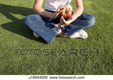 Girl holding an apple View Large Photo Image Stock Photo - Girl holding an apple. Fotosearch