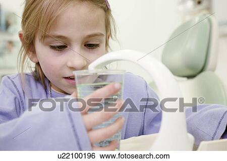 Girl in dental treatment room View Large Photo Image Stock Photograph - Girl in dental treatment room. Fotosearch