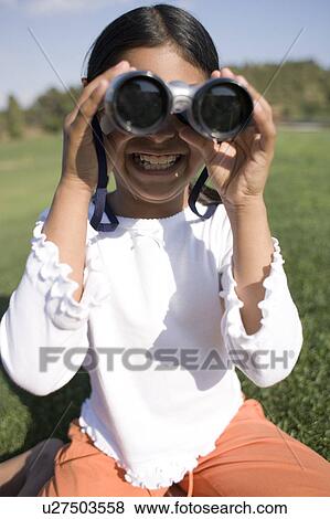 Girl using binoculars View Large Photo Image Stock Photo - Girl using binoculars. Fotosearch