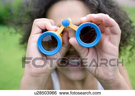 Girl using binoculars View Large Photo Image Stock Photograph - Girl using binoculars. Fotosearch
