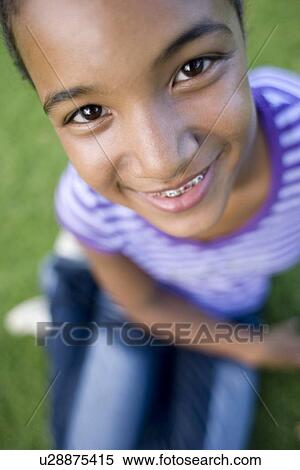 Stock Photography - Girl wearing dental braces. Fotosearch