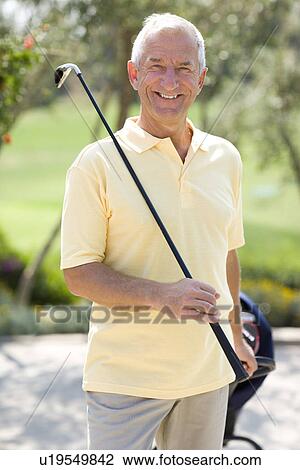 Stock Image - Golf player. Fotosearch
