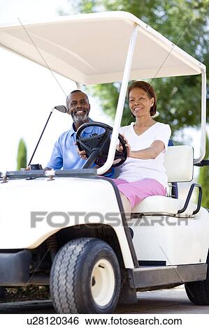Stock Photograph - Golf players. Fotosearch
