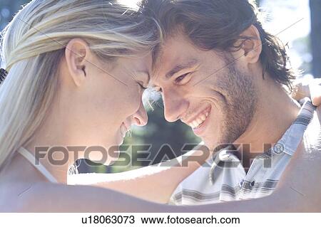 Happy couple embracing View Large Photo Image Stock Image - Happy couple embracing. Fotosearch