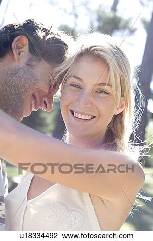 Stock Image - Happy couple embracing. Fotosearch