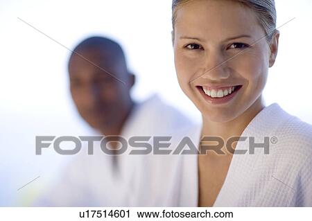 Stock Image - Happy couple relaxing at a spa. Fotosearch