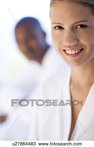 Stock Image - Happy couple relaxing at a spa. Fotosearch