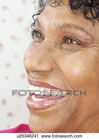 Stock Image - Happy middle-aged woman. Fotosearch