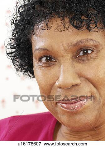 Stock Photo - Happy middle-aged woman. Fotosearch