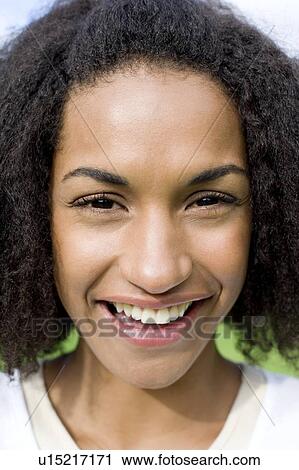 Stock Image - Happy woman outdoors. Fotosearch