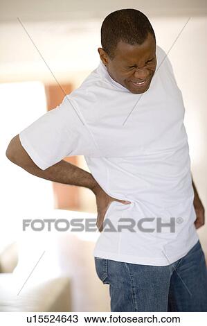 Lower back pain View Large Photo Image Stock Image - Lower back pain. Fotosearch