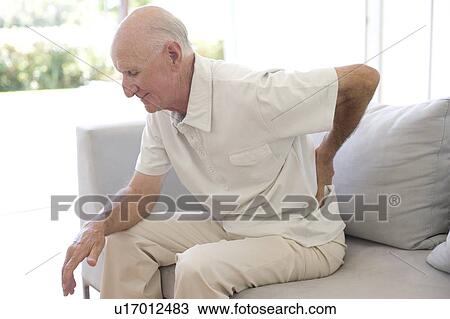Stock Image - Lower back pain. Fotosearch