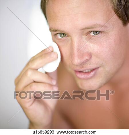 Stock Image - Male skin care routine. Fotosearch