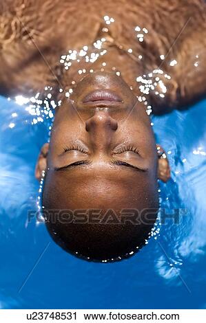 Stock Image - Man floating. Fotosearch